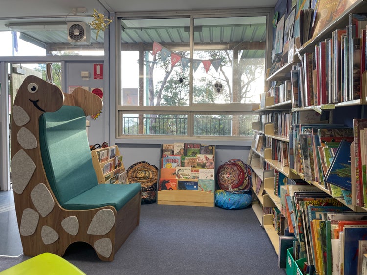 Library with dinosaur chair and cushions