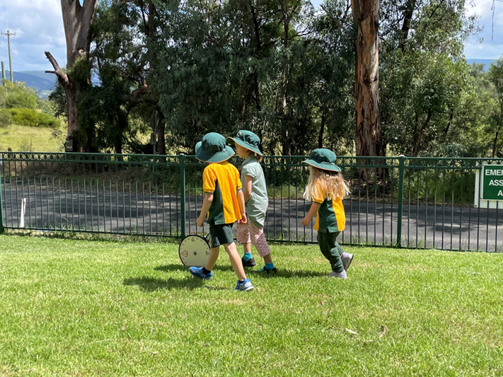 students outside measuring distance