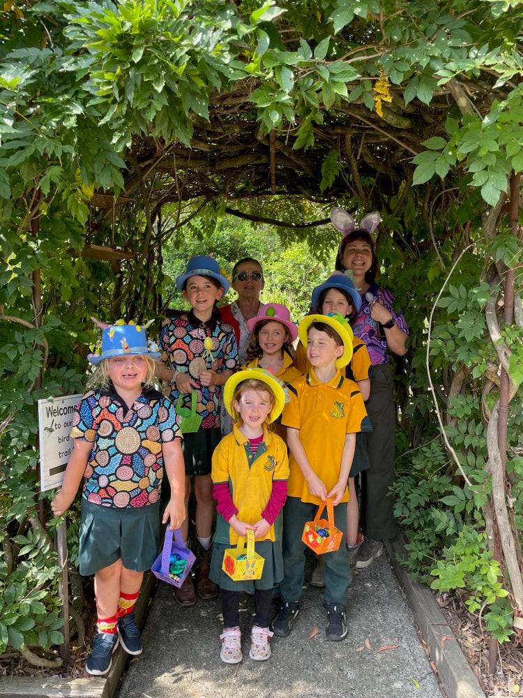 students and teachers in easter hats