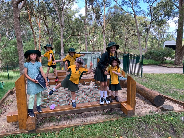 students on play equipment