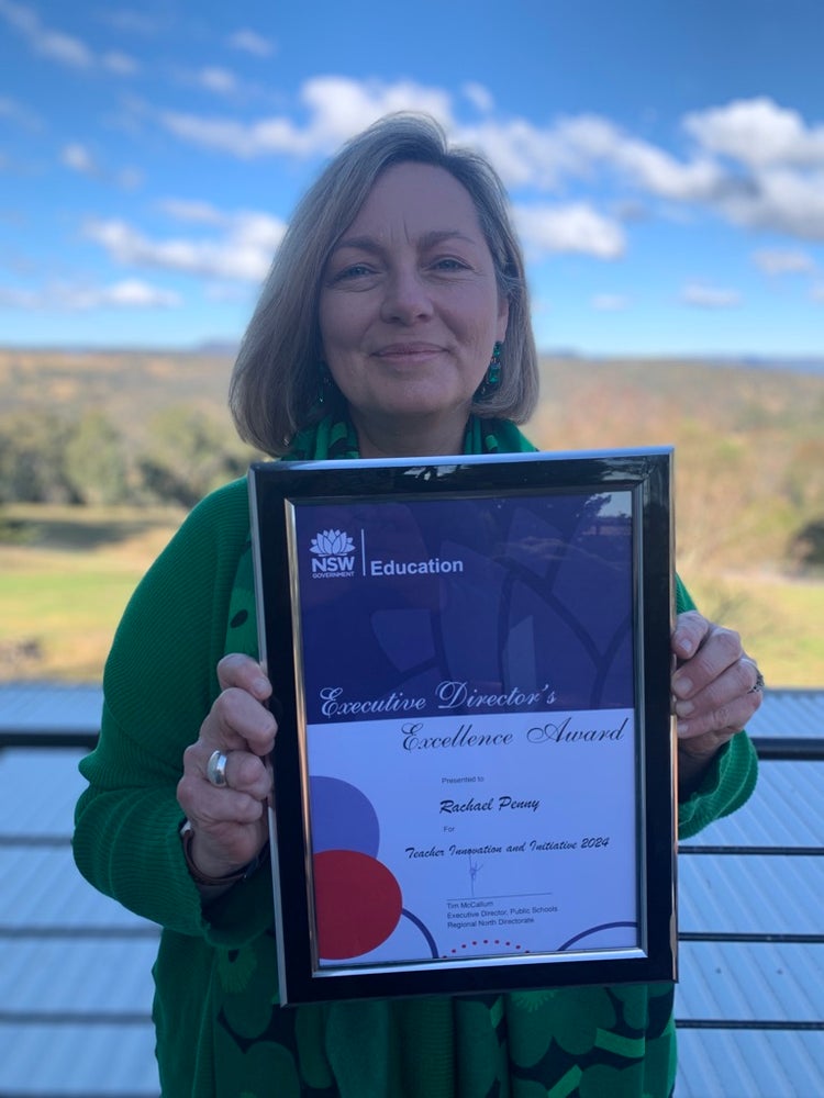 Our principal receiving an award for excellence