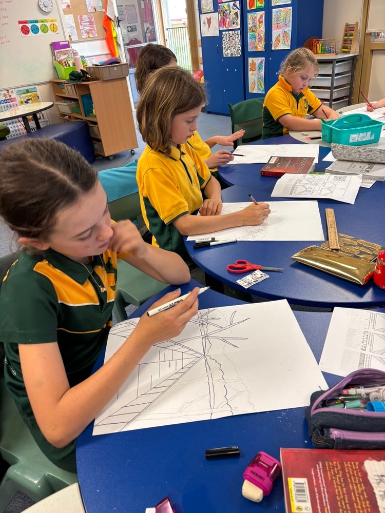 students at a desk working