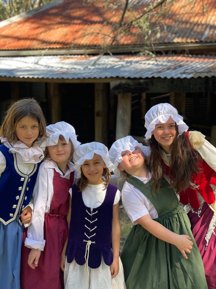 students in costume filming