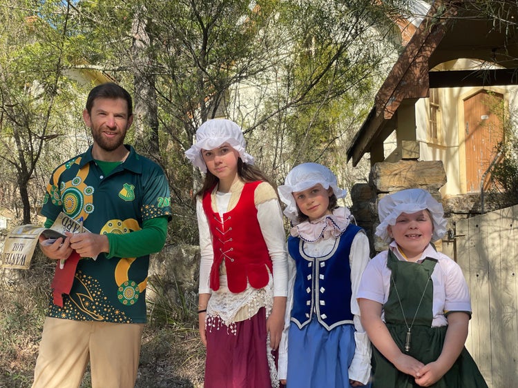 teacher and students in costume