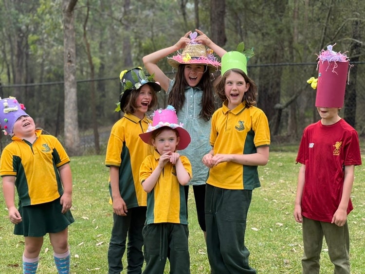 Children laughing wearing their Easter hats